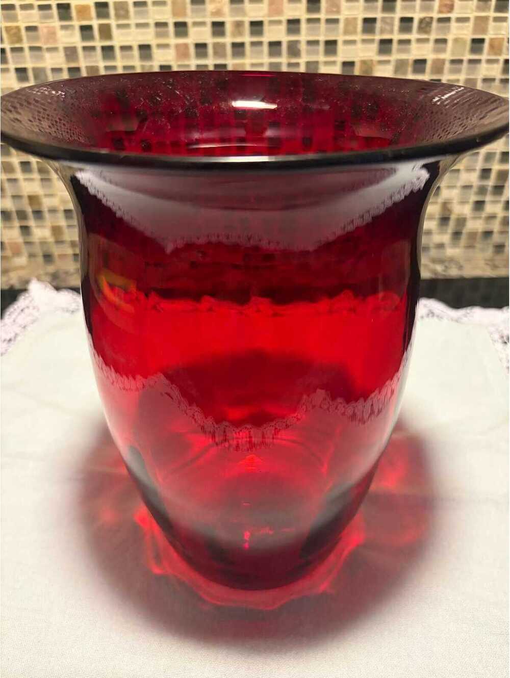 This is a mid-century ruby red optic glass vase.